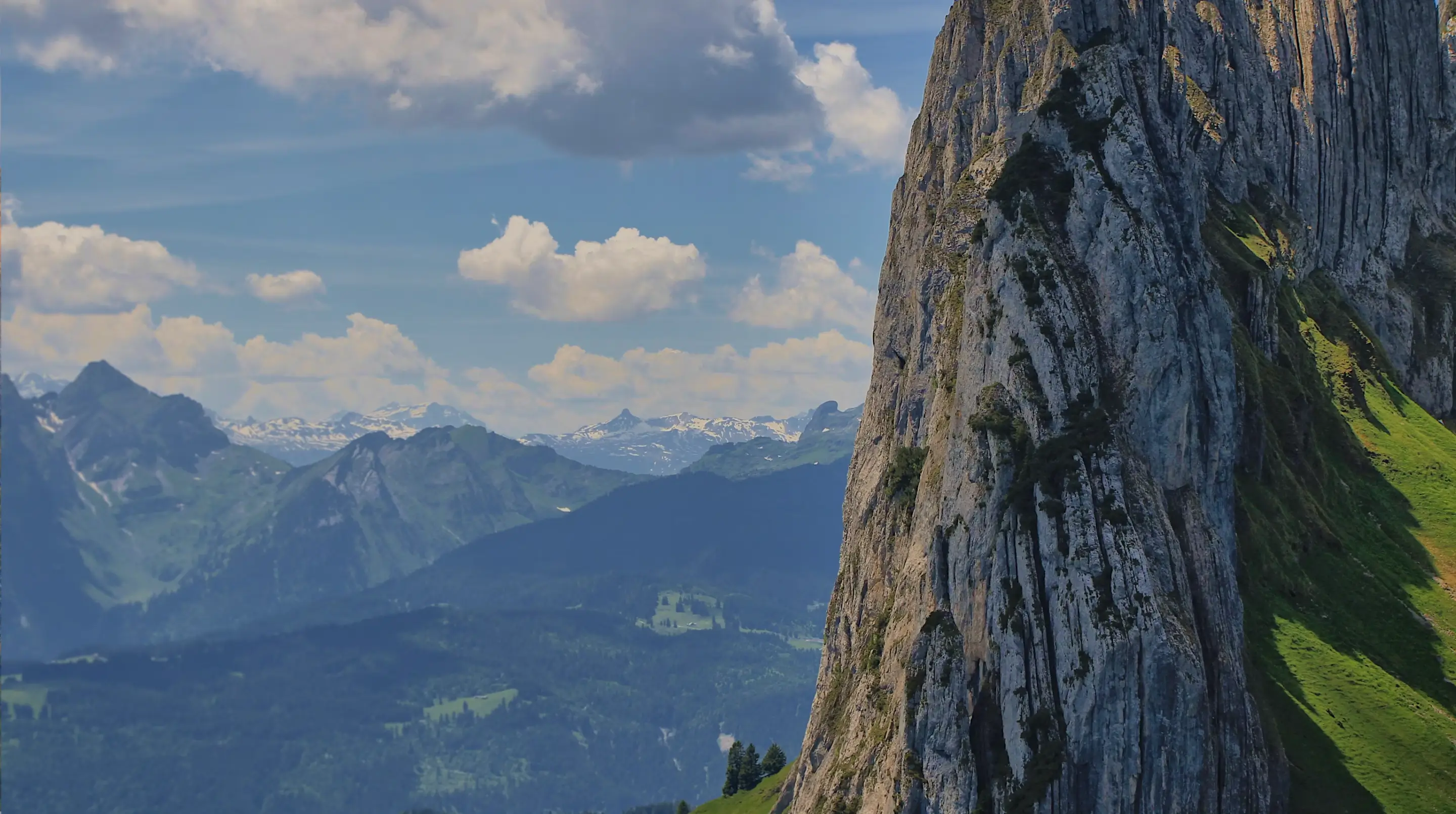 Mountain range beneath a cloudy sky
